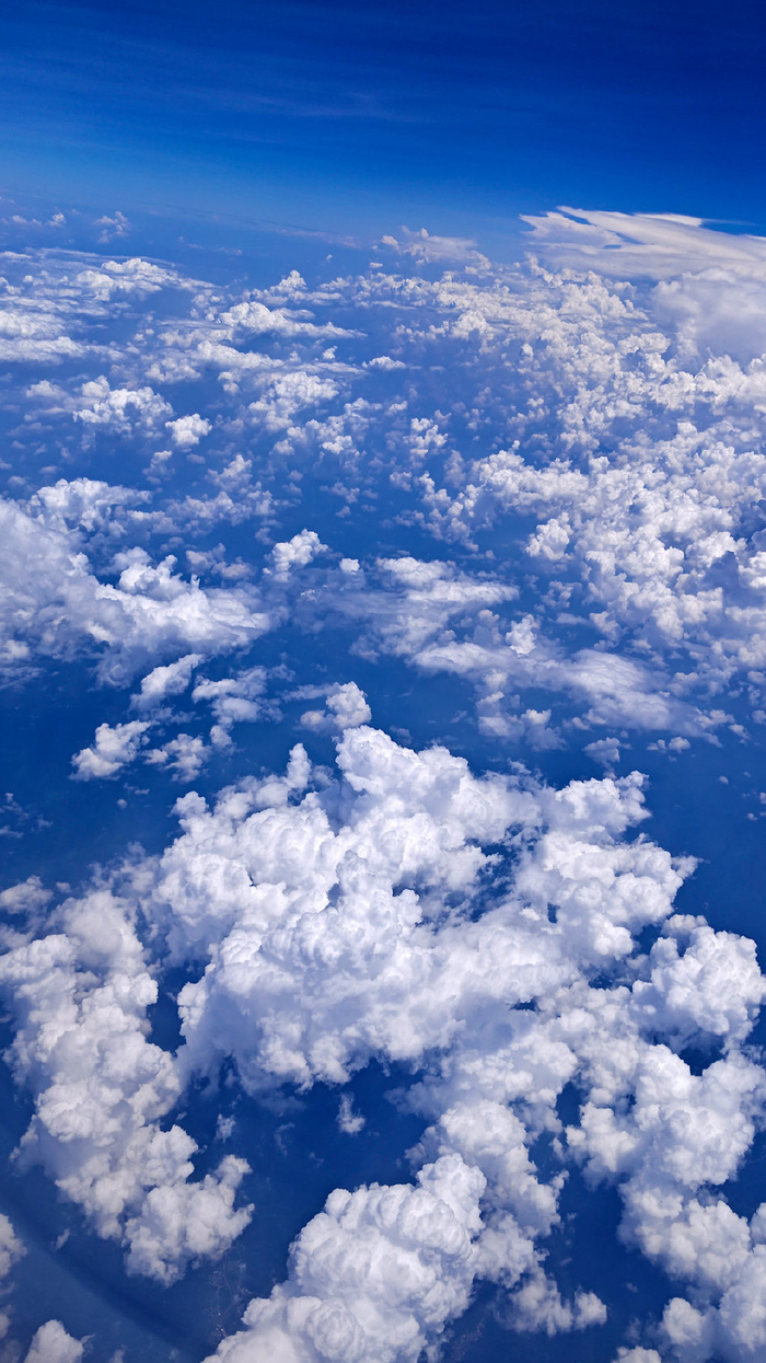 从飞机往外看_飞机舷窗拍摄技巧_乘坐飞机观赏云海